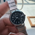 Élégante montre à quartz pour femme avec cadran noir et bracelet en acier argenté - Bracelet Argenté Cadran Noir