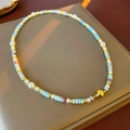 Detail of beaded necklace featuring blue stones, white pearls and gold magnetic clasp - Blue White Pearl Shoushan Stone Necklace (#45)