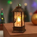Close-up of vintage bronze Christmas lantern with elk silhouette and warm LED glow - Brushed Gold Reindeer