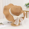 Straw sun hat with wide wavy brim and white lace bow decoration in khaki color - Lace Plum Wave Khaki
