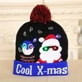 Black knitted Christmas hat with Santa, penguin, LED lights and red pompom - Owl Santa Pattern