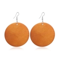 Macro shot of natural wood grain texture on round orange earrings with silver hooks - #2 Orange Solid Round Wood Grain