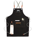 Black canvas work apron featuring leather straps and multi-pocket utility design - Thick Black Canvas with Ribbon Straps & Loop