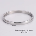 Detail showing 6mm width and 58x50mm inner diameter dimensions of the silver bangle - Women's Steel Color