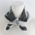 Detail of a 70cm silk-like scarf with black and white geometric patterns on a mannequin - Black / 70x70cm
