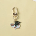Golden bachelor cap keychain with red roses and diploma charm on yellow background - Style 3 (Gate Buckle)