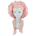 Pink satin sleep bonnet featuring wide elastic band and long decorative ribbon ties - Coral