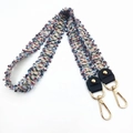Macro view of woven tweed replacement shoulder strap with gold metal lobster clasps - Blue and Purple
