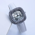 Detail of square silver watch face with Roman numerals and diamond-encrusted bezel - White Silver Case