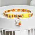 Close-up of Halloween pet collar with mummy charm, orange pumpkin and ghost print - Pumpkin Ghost