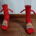 Red Christmas novelty socks with magnetic holding hands and festive reindeer pattern - Red Heart Reindeer