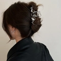 Detail of silver liquid metal hair claw clip worn on hair bun with a modern aesthetic - Shiny Silver Irregular Style (FJ3581)
