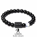 Détail du bracelet Balance en obsidienne avec perle du zodiaque mate et pierre lumineuse - Balance