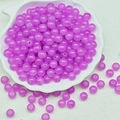 Macro detail of purple translucent round beads for DIY jewelry in a shell tray - 4mm / Light Purple