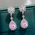 Elegant drop earrings featuring pink pear-cut gemstones with floral crystal stud details - Pink