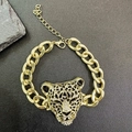 Gold plated punk leopard head bracelet with sparkling cubic zirconia on dark shale - Gold Leopard Head Pave Clear Faux Diamond Bracelet