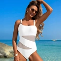Close-up of white one-piece swimsuit with sheer mesh cutouts and metallic ring detail - S / White