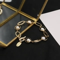 Elegant gold pearl bracelet featuring white pearls and a sparkling OT clasp design - Oval Circle Pearl Tag Bracelet