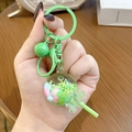 Green lollipop keychain with colorful beads and floating snowflake sequins in a clear ball - Green Lollipop Milk Bean