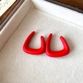 Macro shot of red U-shaped earrings with matte finish on a beige velvet jewelry tray - 102# Matte Geometric U-Shape (Silver Earring Post) / Red