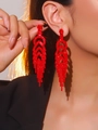 Sparkling red rhinestone long tassel earrings with premium finish on model - Red Party Dinner Tassel Earrings