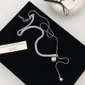 Silver Y-necklace with sparkling tennis chain, grey pearl pendant, and layered style - Shell Pearl Zirconia Necklace