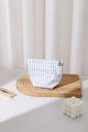 Detail of light blue checkered fabric makeup bag with golden flower zipper and blue bow - Small / Blue Plaid