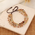 Macro detail of Bohemian multilayer beaded bracelet with crystals on marble stone - Brown Gold White Tone (4#)