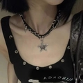 Macro shot of Y2K gothic silver star pendant with leather chain on a black vest - Skull Star Choker X3652