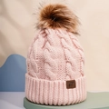 Detailed knit pattern and faux fur pompom on pink cable knit beanie with leather patch - One Size / Light Pink