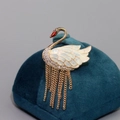 Elegant gold swan brooch with white enamel wings and sparkling crystal fringe tassels - Swan Tassel Enamel