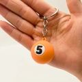 Close-up of orange billiards keychain featuring number 5 on a white background - Number 5 (Orange)