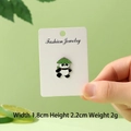 Panda enamel pin wearing a green hat with red bag, 1.8x2.2cm animal badge accessory - Panda with Bamboo Basket