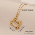 Golden stainless steel necklace featuring a crab pendant with a white opal stone inlay - Crab