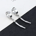 Detailed view of silver bamboo-style pendant earrings with stainless steel hoop closure - Bamboo - Steel