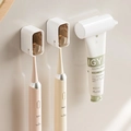 Wall-mounted brown toothbrush holder set with two cups and a white toothpaste squeezer - Amber*2 + Squeezer