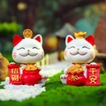 Cute white ceramic lucky cat figurines with Fortune and Peace scrolls for desktop decor - Pair of Luck and Peace