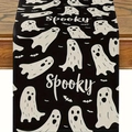 Detail view of black linen table runner featuring white ghost patterns and spooky text - Black Background Single Large Ghost Spooky
