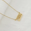 Collier en acier inoxydable doré avec pendentif année 2005 poli sur fond de fausse fourrure - 2006