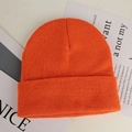 Classic bright orange acrylic knit beanie with fine ribbed texture and folded cuff style - Orange Red