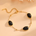 Dettaglio del bracciale in acciaio inossidabile dorato con opali neri e chiusura - Bracciale Nero (A618)