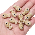 Beige ceramic fish beads with white polka dots for DIY jewelry making and bracelets - Brown