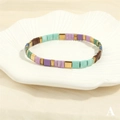Detail of bohemian Tila bead bracelet with purple and mint green square glass beads - Purple Green Blue Brown Gold