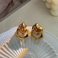 Elegant gold double hoop geometric earrings displayed in a white seashell tray - Gold Double Geometric Hoop Earrings
