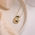 Polished 18K gold plated balloon bubble initial C pendant necklace on silk backdrop - Letter C (Single Pendant)