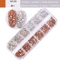 Detail view of 12-grid nail art box with 1440 amber and white flatback glass rhinestones - Amber + Protein + Gold Bottom White (08)