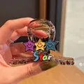 Brown acrylic hair claw clip with colorful smiling star patterns and Star text - Star Style - Star