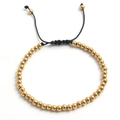 Detail of 18k gold plated stainless steel beads on a black adjustable braided cord - Gold 4mm