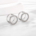 Macro detail of silver geometric double hoop earrings with pavé cubic zirconia inlay - Ear Buckle / Steel White Round