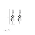 Detailed view of silver snake earrings showing 4.6cm height and 1.3cm width dimensions - Black Silver